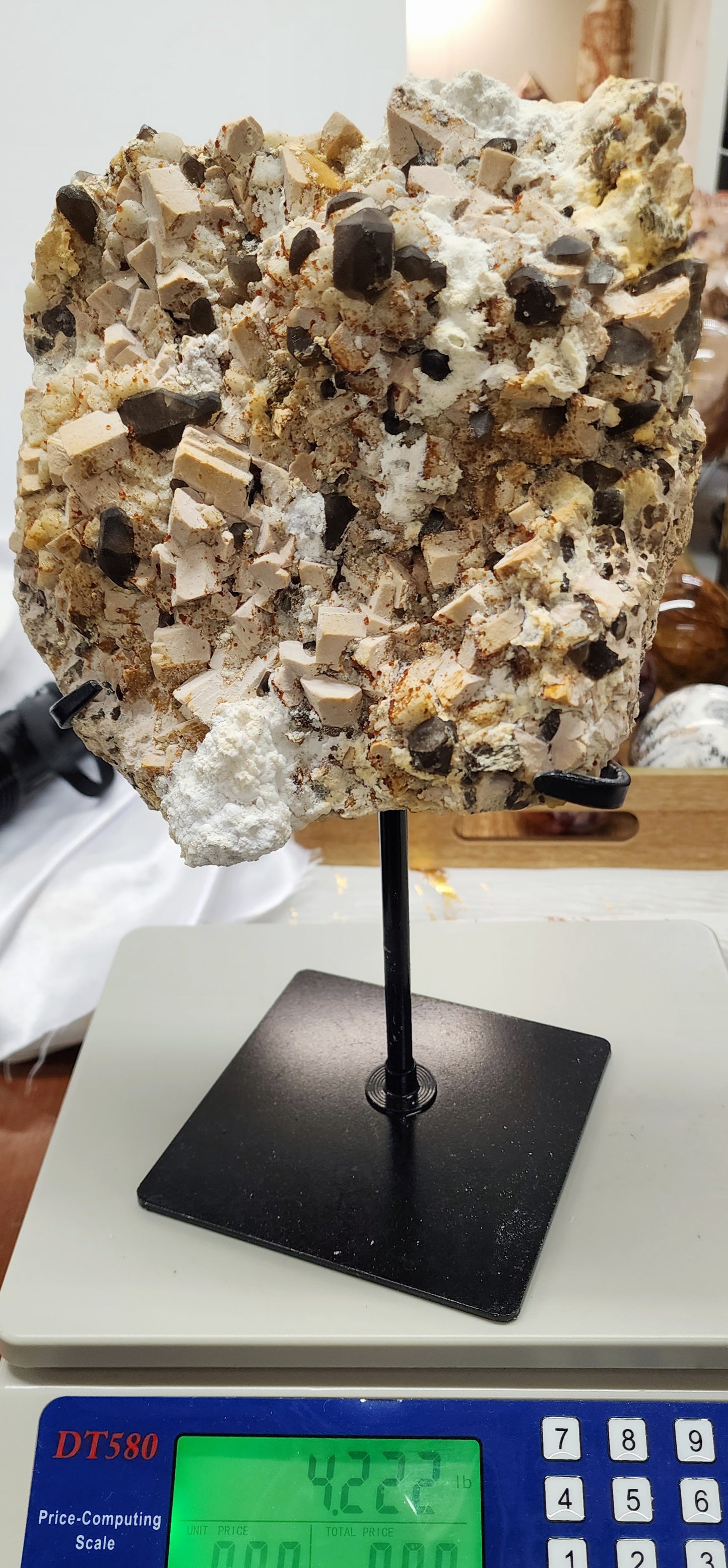 Large Amber Calcite W/ Smoky Inclusion and Aroganite on Metal Stand UV over 3.5lbs