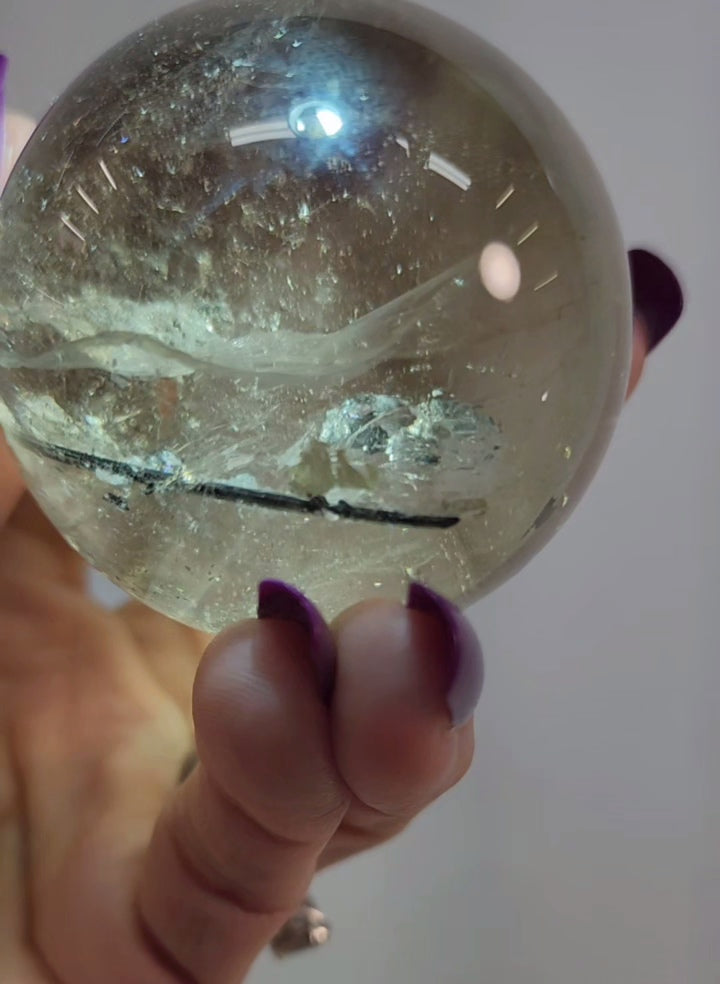 Clear Smoky Citrine Sphere with Black Tourmaline/ Rutile and White Phantom